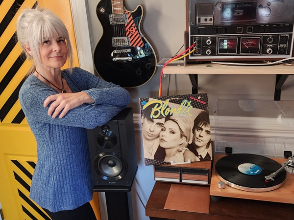MGA's Tina Ashford and her current favorite vinyl album.